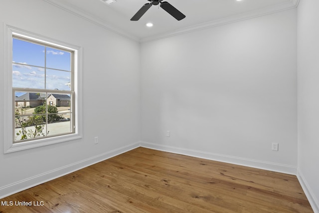 unfurnished room featuring crown molding, recessed lighting, ceiling fan, wood finished floors, and baseboards