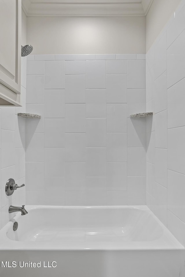 bathroom featuring ornamental molding and shower / bath combination