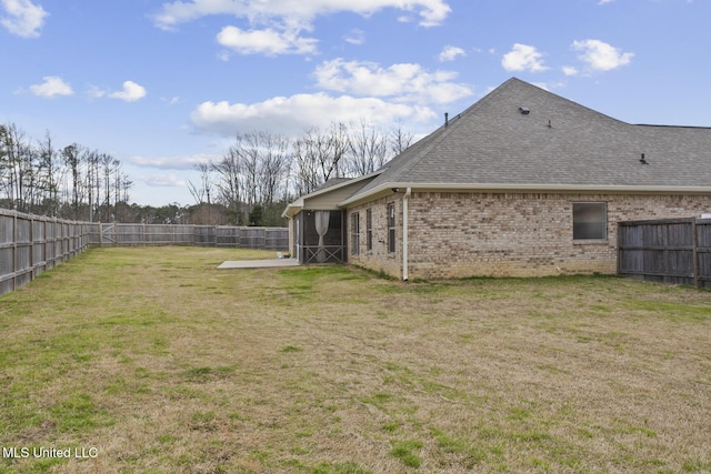 view of yard with a fenced backyard