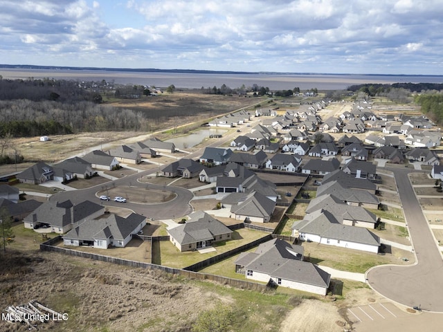 birds eye view of property with a residential view