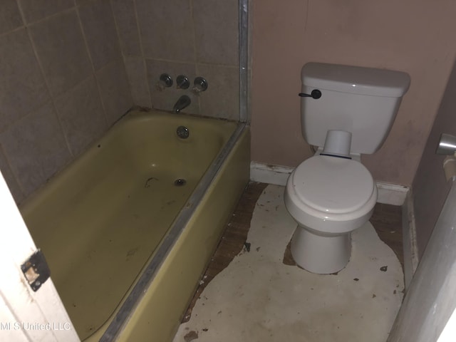 303 Old Spanish Trl, Jackson, MS 39212 - full bathroom featuring a bath, toilet, and baseboards