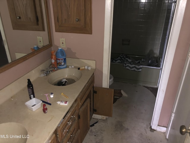 303 Old Spanish Trl, Jackson, MS 39212 - full bathroom with toilet, concrete flooring, double vanity, and  shower combination