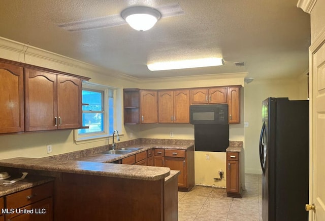 kitchen featuring crown molding, a textured ceiling, black appliances, and sink