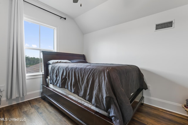 bedroom featuring dark wood-type flooring, ceiling fan, and vaulted ceiling