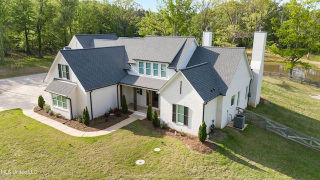 4270 Sunset Rd, Nesbit, MS 38651 - view of front of home featuring a chimney, roof with shingles, covered porch, central air condition unit, and fence