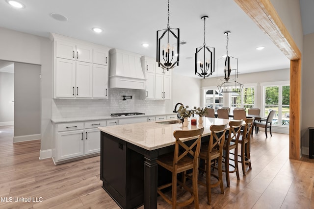 4270 Sunset Rd, Nesbit, MS 38651 - kitchen with recessed lighting, custom exhaust hood, backsplash, a sink, and gas cooktop