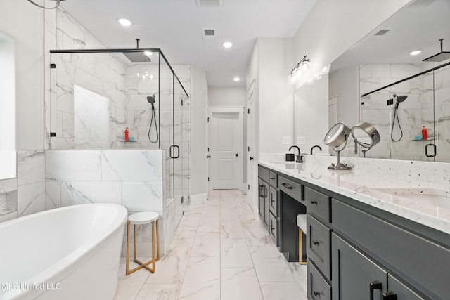 4270 Sunset Rd, Nesbit, MS 38651 - bathroom featuring a soaking tub, a shower stall, a sink, recessed lighting, and marble finish floor