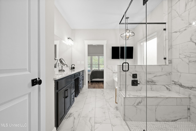 4270 Sunset Rd, Nesbit, MS 38651 - ensuite bathroom with connected bathroom, marble finish floor, a shower stall, and vanity