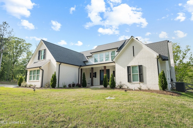 4270 Sunset Rd, Nesbit, MS 38651 - modern farmhouse style home featuring a front lawn, covered porch, central air condition unit, and brick siding