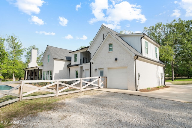 4270 Sunset Rd, Nesbit, MS 38651 - view of side of property featuring brick siding, fence, a garage, driveway, and roof with shingles