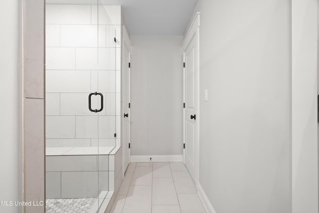 4270 Sunset Rd, Nesbit, MS 38651 - bathroom with a stall shower, tile patterned floors, and baseboards