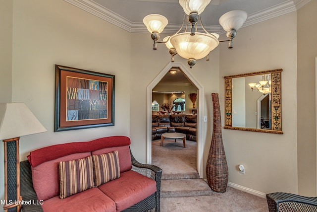 living area featuring baseboards, carpet flooring, an inviting chandelier, and crown molding