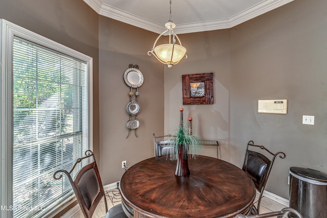 dining area featuring baseboards and ornamental molding