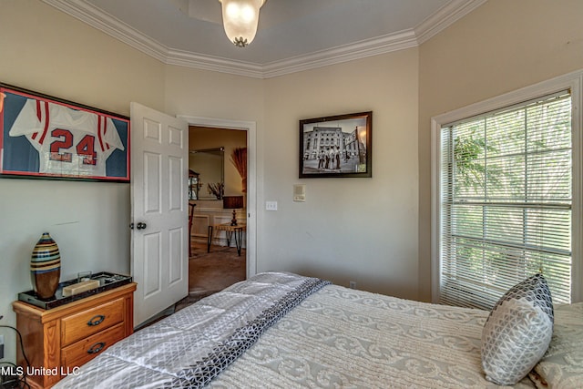 bedroom featuring carpet flooring and crown molding