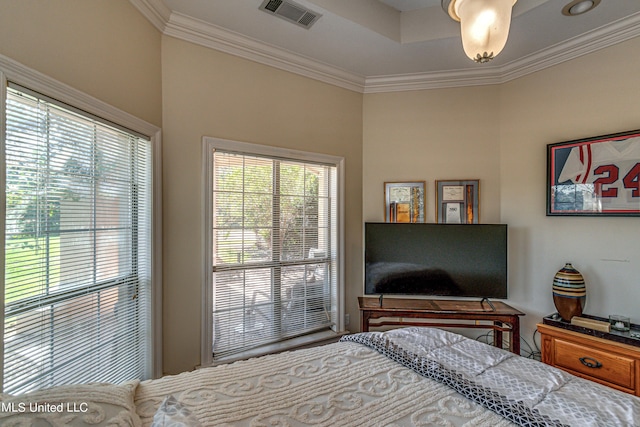 bedroom featuring ornamental molding and visible vents