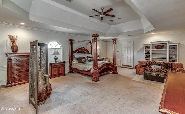 carpeted bedroom with recessed lighting, a raised ceiling, crown molding, and ceiling fan