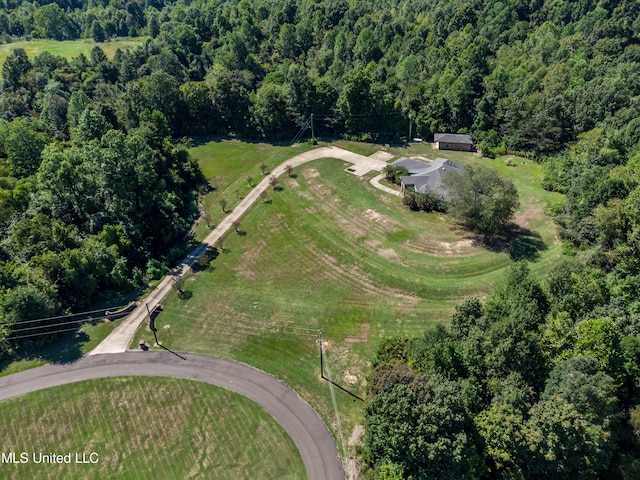 aerial view with a wooded view