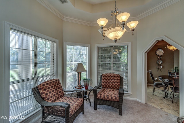 sitting room featuring a chandelier, light tile patterned floors, light carpet, baseboards, and ornamental molding