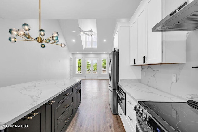 414 Shell St, Biloxi, MS 39530 - kitchen with exhaust hood, stainless steel appliances, white cabinetry, dark cabinetry, and wood finished floors