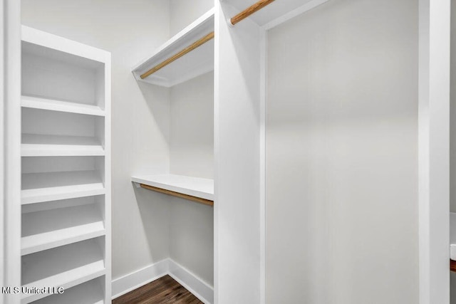 414 Shell St, Biloxi, MS 39530 - spacious closet featuring dark wood-style flooring