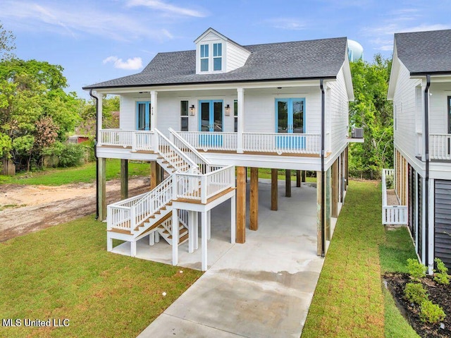 414 Shell St, Biloxi, MS 39530 - view of front of home with a carport, concrete driveway, roof with shingles, a porch, and stairs