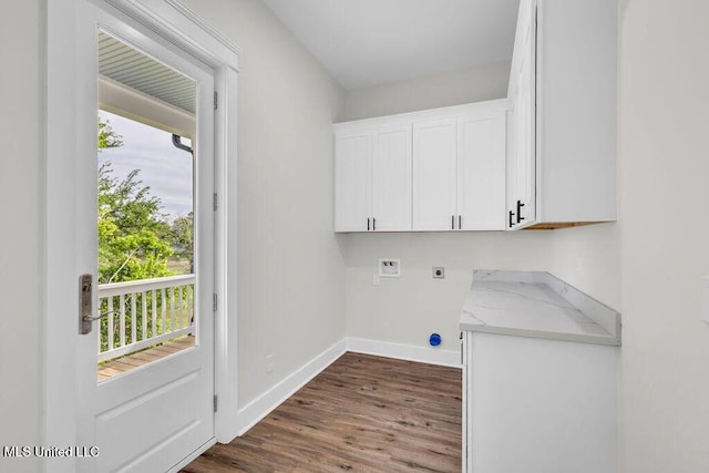 414 Shell St, Biloxi, MS 39530 - laundry area with electric dryer hookup, hookup for a washing machine, cabinet space, dark wood finished floors, and baseboards
