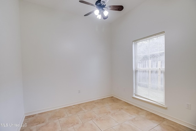 unfurnished room with ceiling fan and light tile patterned floors