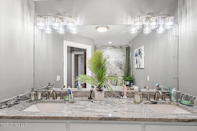 bathroom with walk in shower and vanity