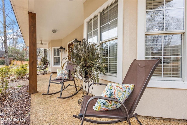 view of patio featuring ceiling fan