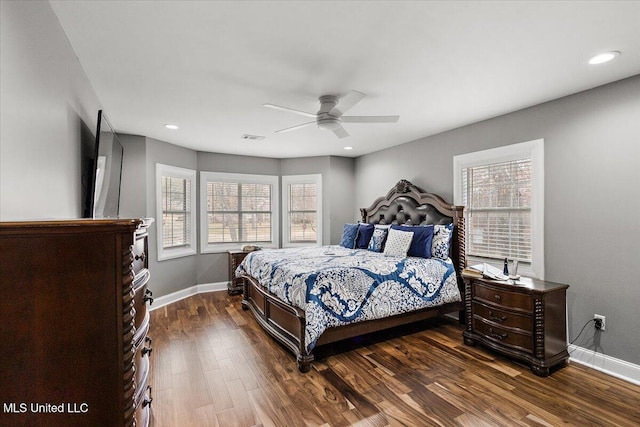 bedroom featuring dark hardwood / wood-style flooring and ceiling fan