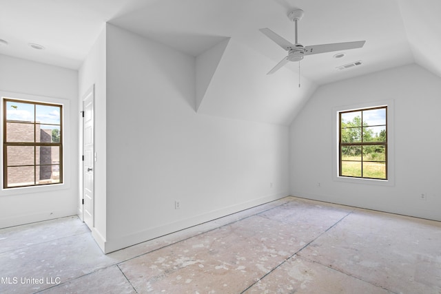 additional living space with vaulted ceiling, a ceiling fan, visible vents, and baseboards