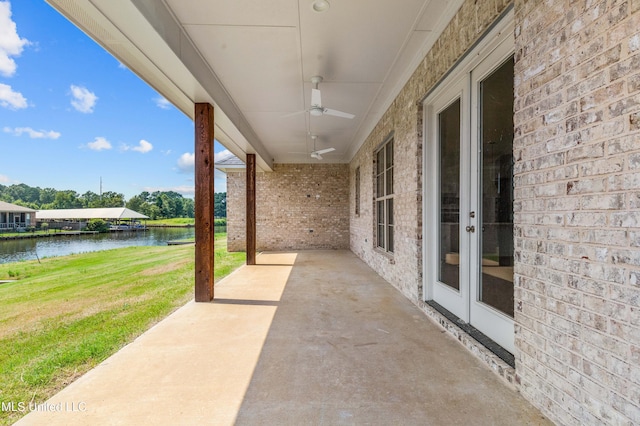 view of patio with a water view