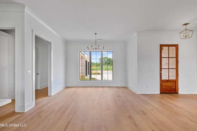 unfurnished dining area featuring a chandelier, light wood-type flooring, baseboards, and ornamental molding