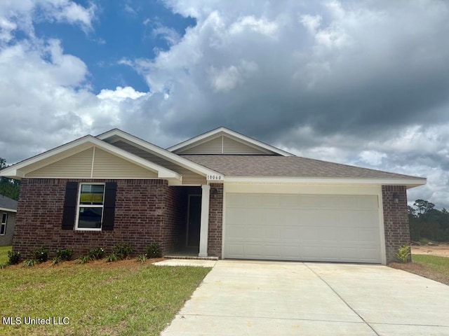 18060 Tiffany Renee Dr, Gulfport, MS 39503 - ranch-style house featuring brick siding, driveway, an attached garage, and a front yard
