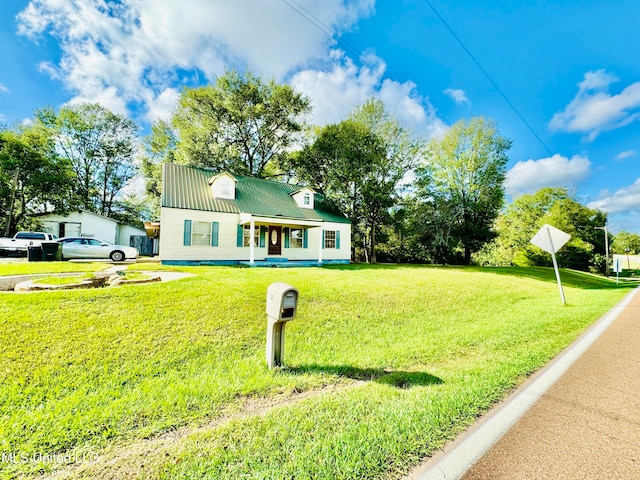 view of front facade with a front lawn and covered porch