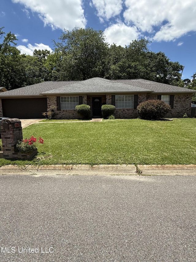 2246 Baywood Dr, Biloxi, MS 39532 - view of front of home featuring an attached garage, a front yard, and driveway