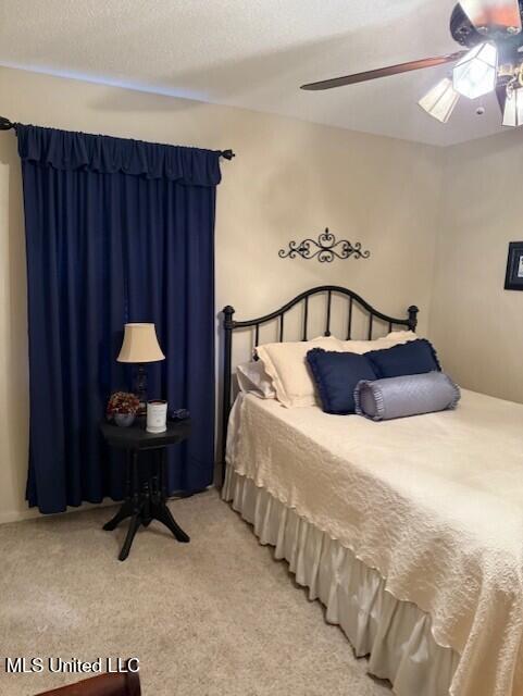 2246 Baywood Dr, Biloxi, MS 39532 - bedroom featuring light carpet and ceiling fan