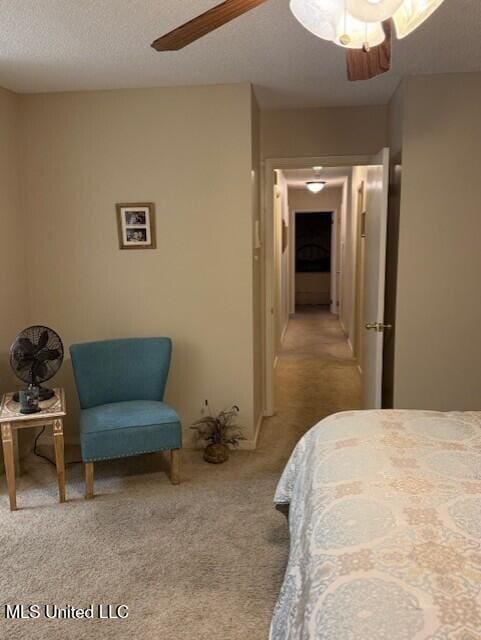2246 Baywood Dr, Biloxi, MS 39532 - carpeted bedroom with a textured ceiling and a ceiling fan