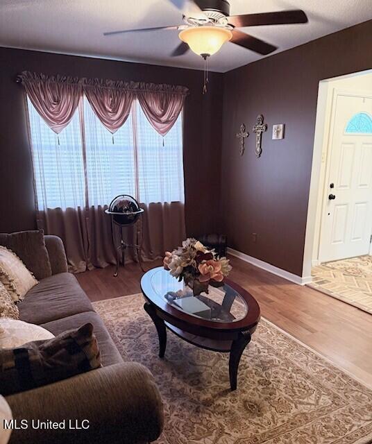 2246 Baywood Dr, Biloxi, MS 39532 - living area featuring ceiling fan, wood finished floors, and baseboards