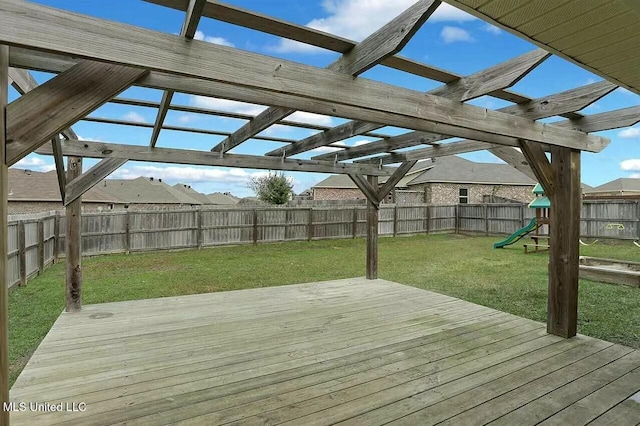 wooden deck with a playground, a pergola, and a yard