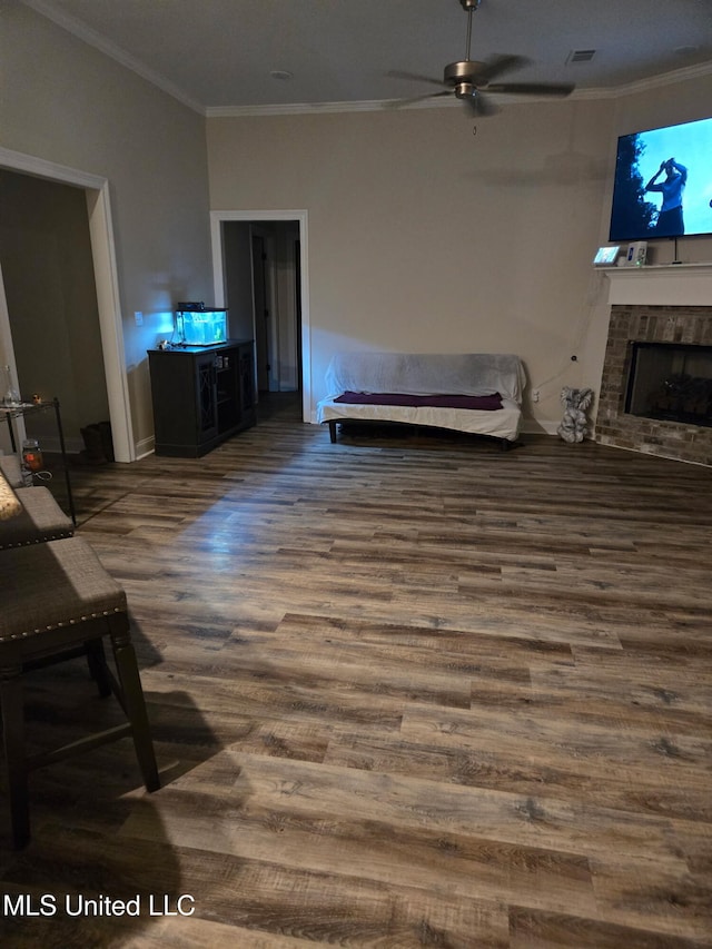 109 Brunswick Cv, Canton, MS 39046 - living area featuring ornamental molding, wood finished floors, ceiling fan, a fireplace, and baseboards