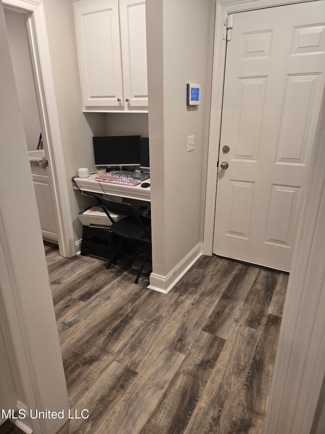 109 Brunswick Cv, Canton, MS 39046 - washroom with dark wood-type flooring, baseboards, and a desk