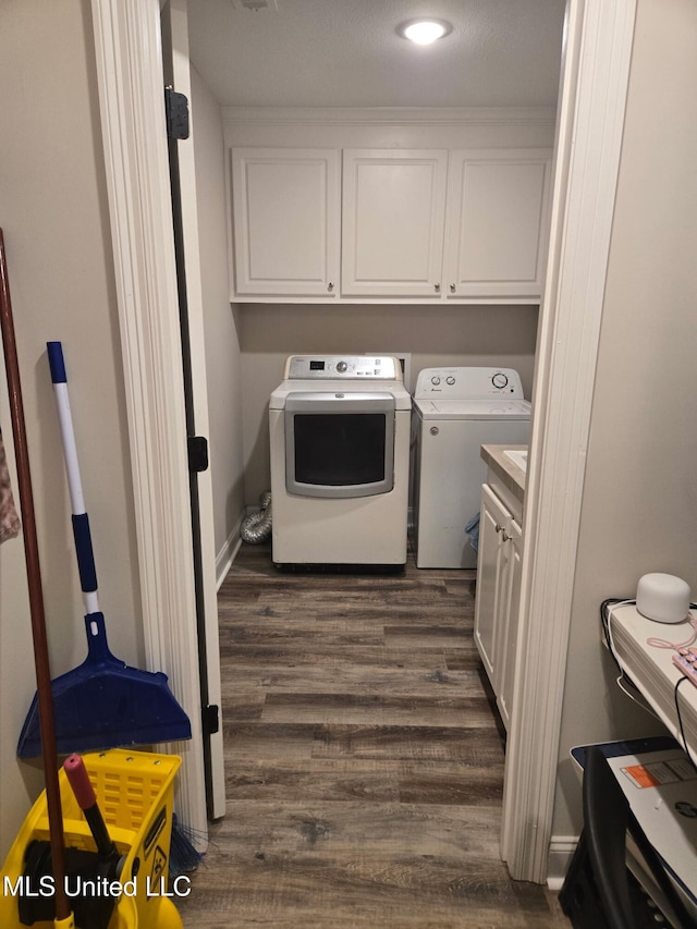 109 Brunswick Cv, Canton, MS 39046 - washroom with cabinet space, washing machine and clothes dryer, dark wood-style floors, and recessed lighting