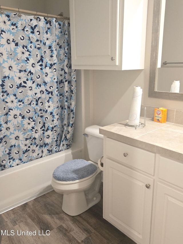 109 Brunswick Cv, Canton, MS 39046 - bathroom with toilet, wood finished floors, shower / bath combo with shower curtain, and vanity