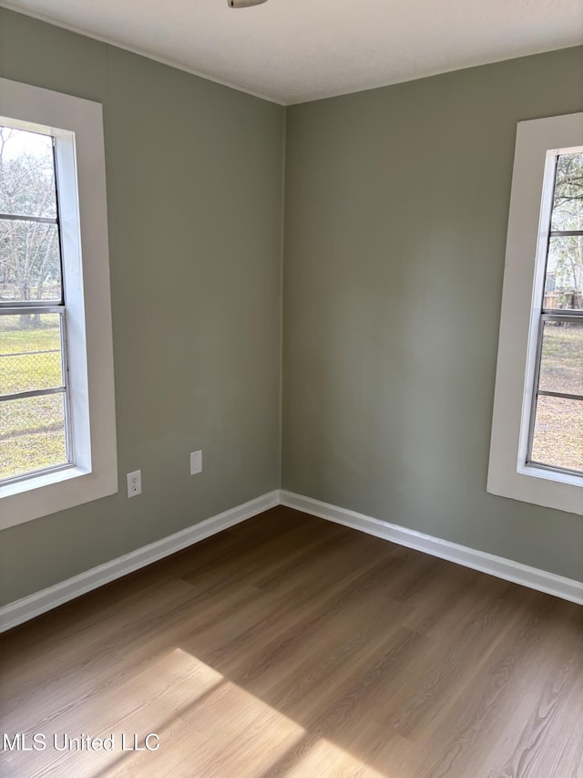 spare room featuring hardwood / wood-style floors