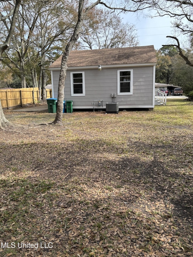 back of property featuring cooling unit