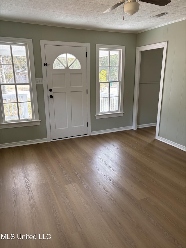 entrance foyer featuring hardwood / wood-style floors, a textured ceiling, a wealth of natural light, and ceiling fan