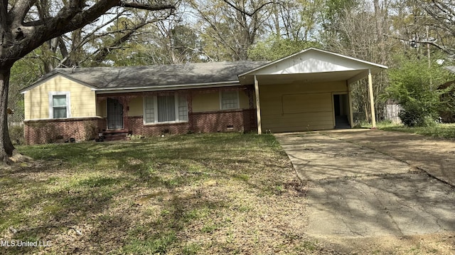 282 Iris Ave, Jackson, MS 39206 - ranch-style house with brick siding, concrete driveway, a front yard, an attached carport, and crawl space