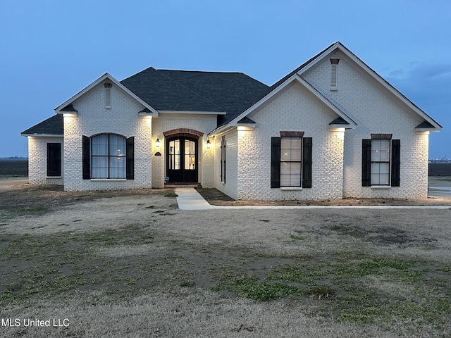 french country style house with french doors