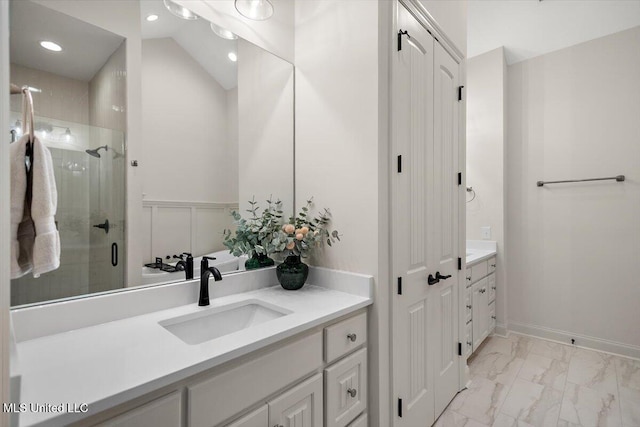 6603 Wirtz Rd, Flowood, MS 39232 - full bath featuring vanity, marble finish flooring, a stall shower, recessed lighting, and wainscoting